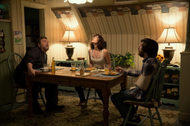 John Goodman as Howard; Mary Elizabeth Winstead as Michelle; and John Gallagher Jr. as Kyle in 10 CLOVERFIELD LANE; by Paramount